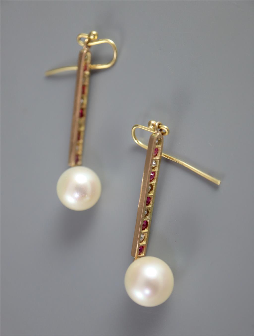 A pair of gold, channel set ruby and diamond drop cultured pearl line earrings,